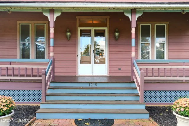 a living room with furniture and a painting