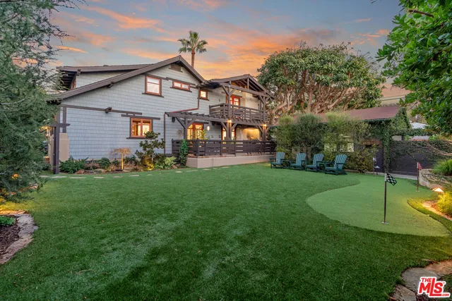 a view of a chairs in a backyard