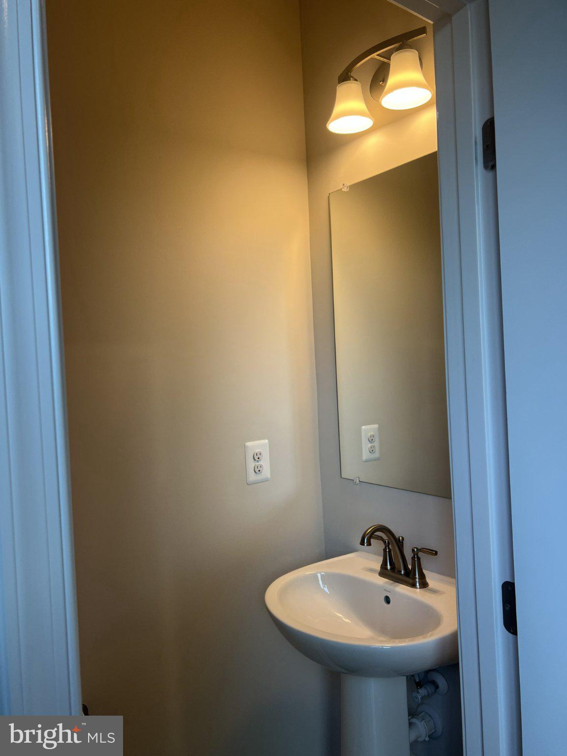 8058 Big Roundtop Road Fort George G Meade, MD 20755 - Photo 24 of 24 a bathroom with a sink and a mirror