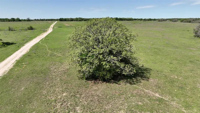 an aerial view of a golf course with houses