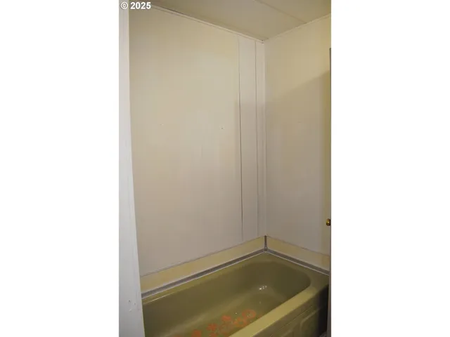 a bathroom with a tub and sink