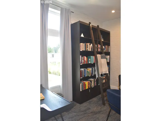 a view of a room with a bookshelf