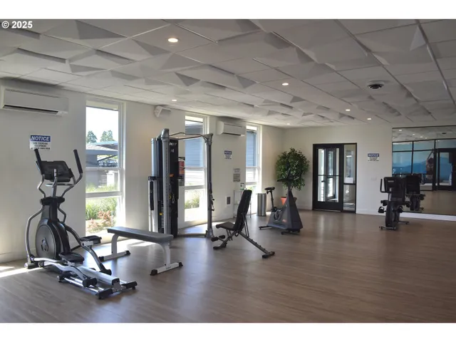 a view of kitchen with sink and mirror