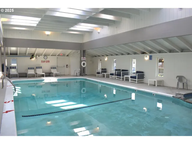 a view of a living room and kitchen area