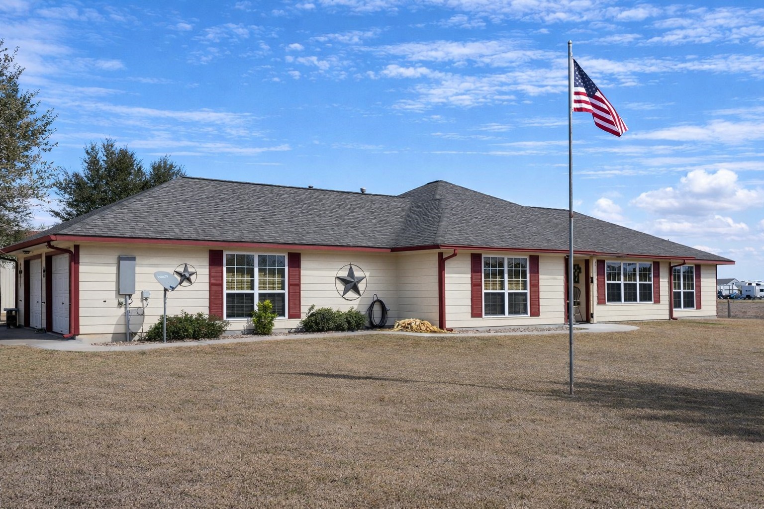 a front view of a house with a garden