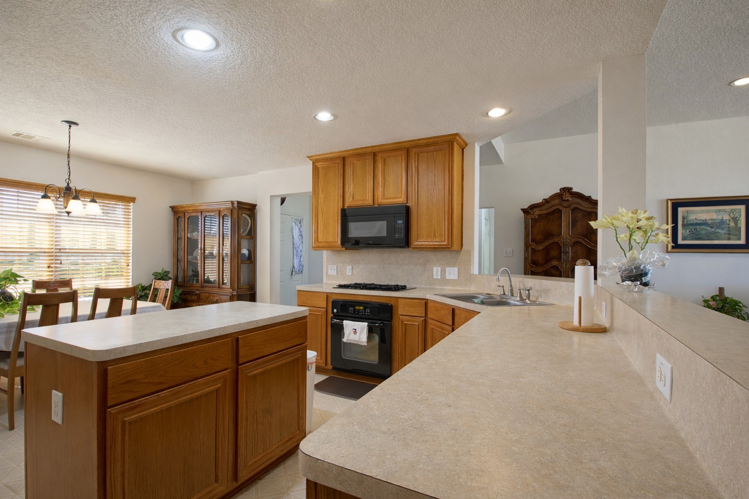 9439 Jeske Road Needville, TX 77461 - Photo 20 of 48 a large kitchen with stainless steel appliances a stove a sink a oven and a refrigerator