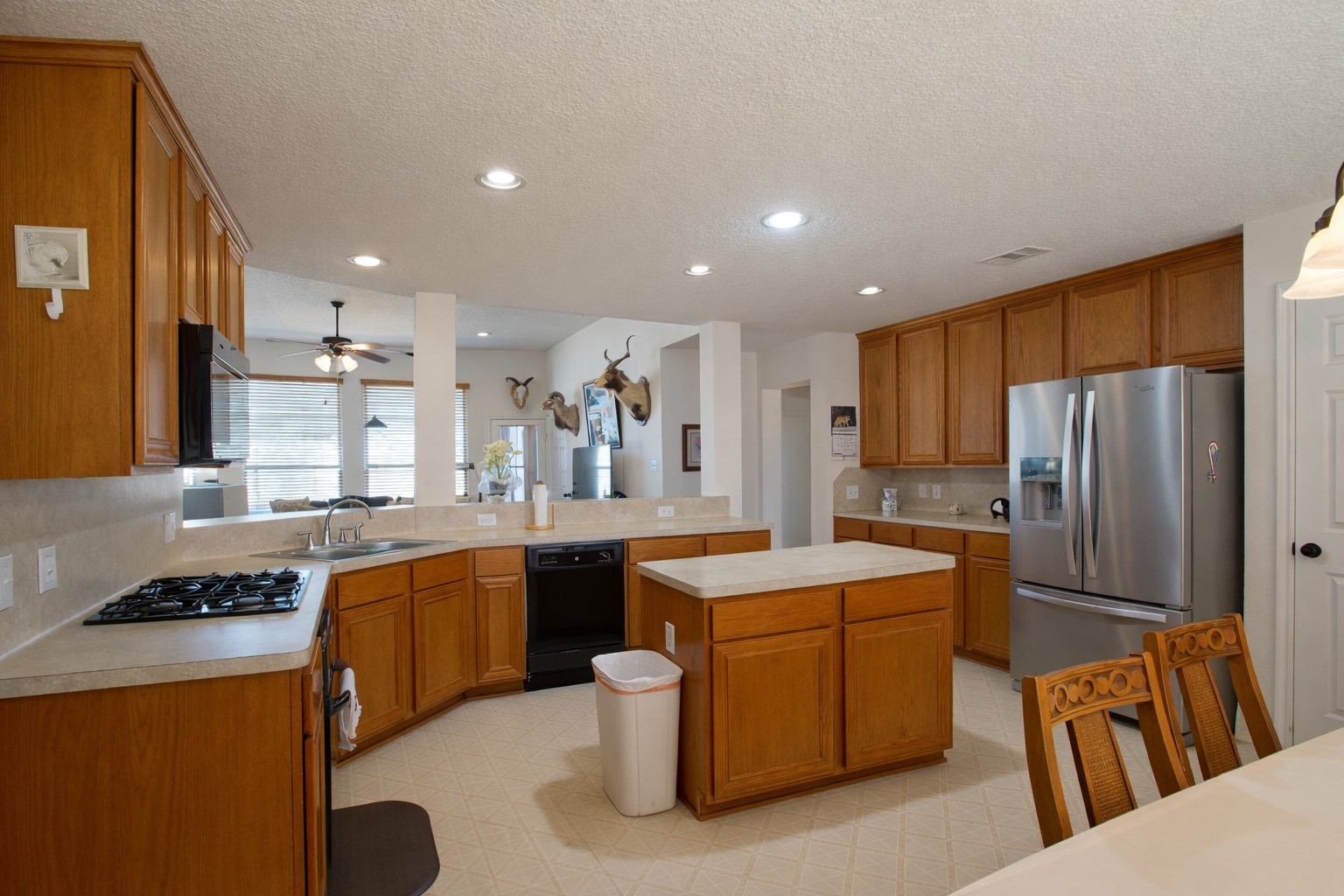 9439 Jeske Road Needville, TX 77461 - Photo 21 of 48 a kitchen with a sink stove and refrigerator