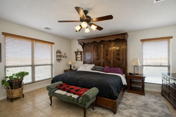 a bedroom with furniture and a window