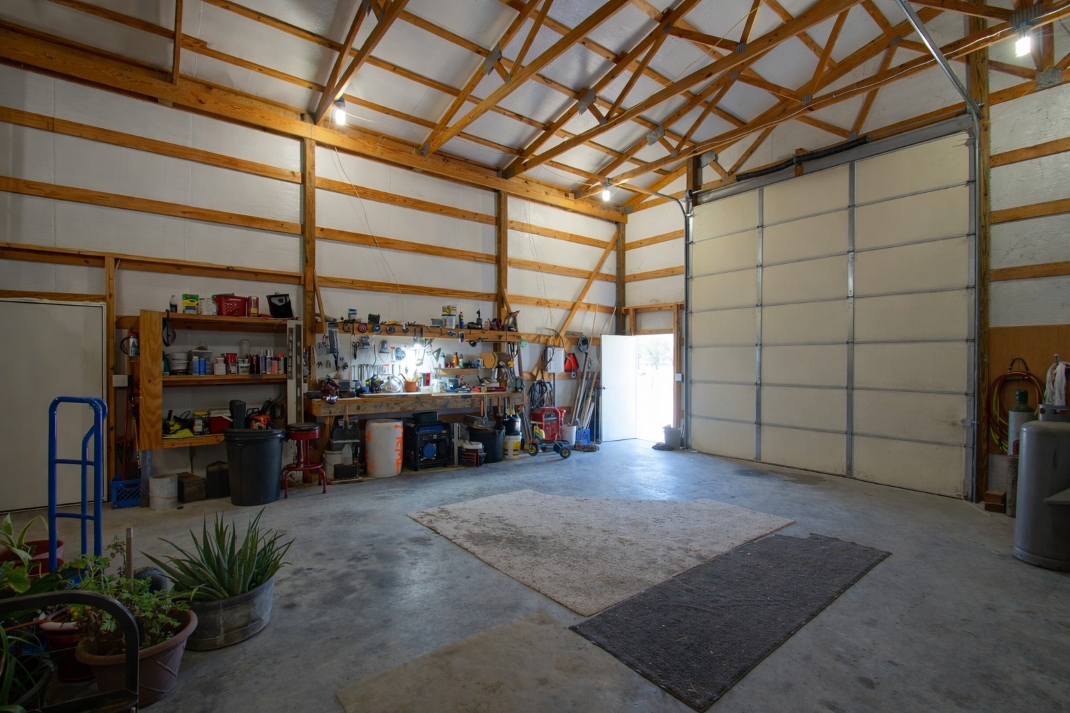 9439 Jeske Road Needville, TX 77461 - Photo 39 of 48 a view of a garage with furniture