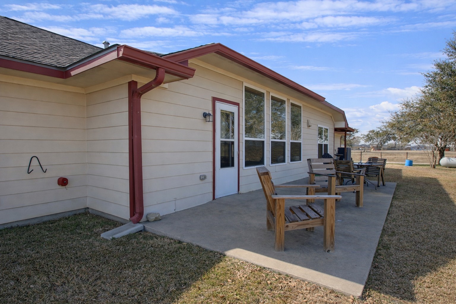 9439 Jeske Road Needville, TX 77461 - Photo 7 of 48 a view of a house with backyard and sitting area