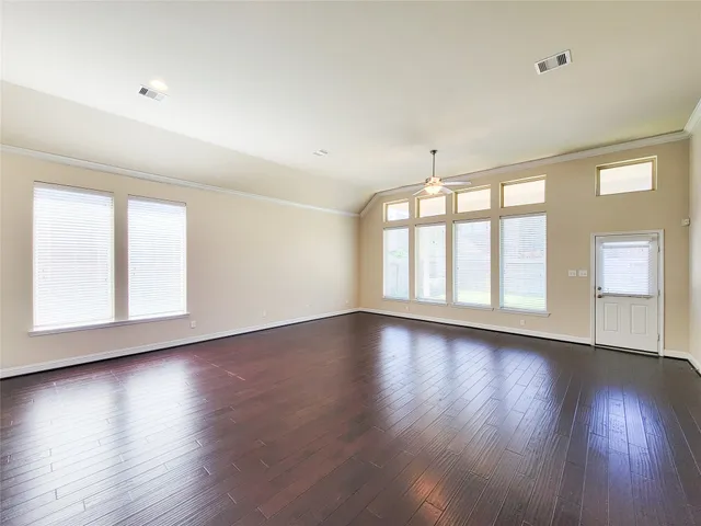 a view of kitchen with furniture and wooden floor