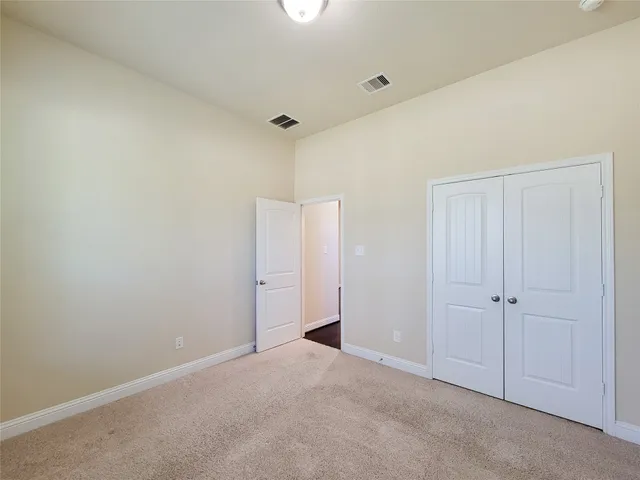 a bathroom with a granite countertop tub sink and mirror