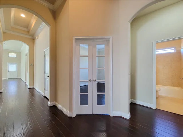 a view of kitchen with granite countertop cabinets and wooden floor