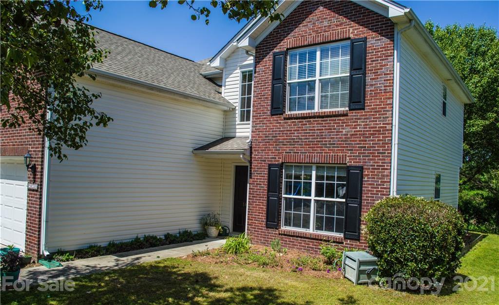 144 Amber Woods Drive Tega Cay, SC 29708 - Photo 2 of 37 a front view of a house with a yard