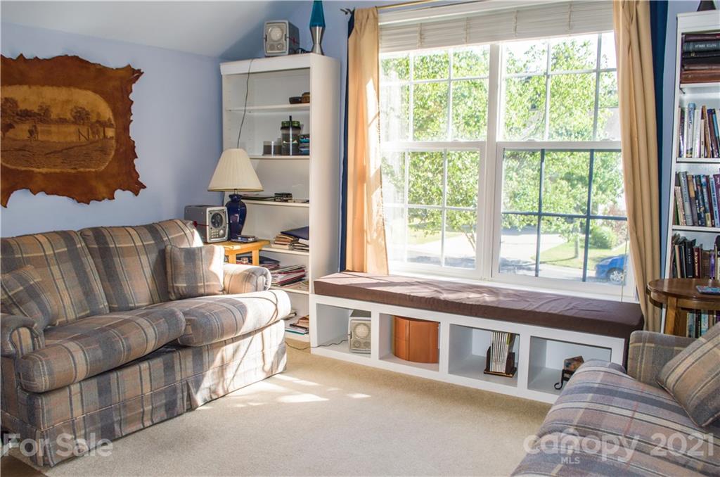 144 Amber Woods Drive Tega Cay, SC 29708 - Photo 17 of 37 a living room with furniture and a large window