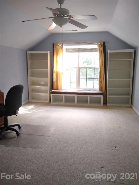 144 Amber Woods Drive Tega Cay, SC 29708 - Photo 18 of 37 a view of room with a ceiling fan and a window