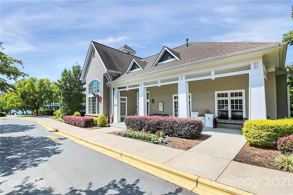144 Amber Woods Drive Tega Cay, SC 29708 - Photo 20 of 37 a front view of a house with lots of potted plants