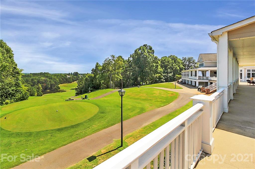 144 Amber Woods Drive Tega Cay, SC 29708 - Photo 29 of 37 a view of a swimming pool with a lounge chairs