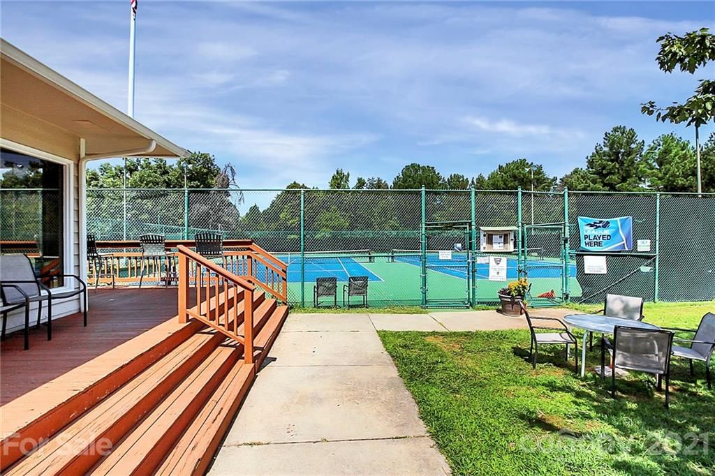144 Amber Woods Drive Tega Cay, SC 29708 - Photo 30 of 37 a view of a park with lounge chairs