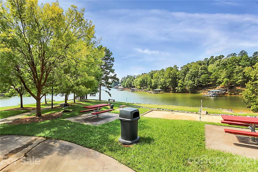 144 Amber Woods Drive Tega Cay, SC 29708 - Photo 33 of 37 a lake view with a garden