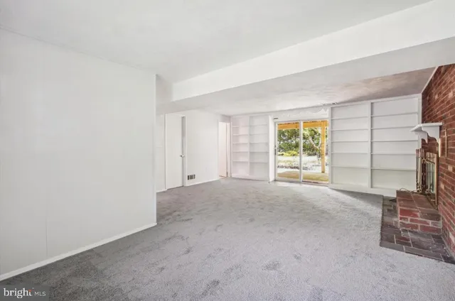 an empty room with windows