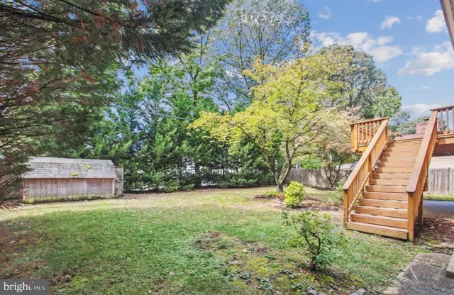 a garden with trees in the background