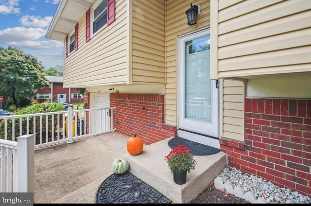 a front view of a house with chairs