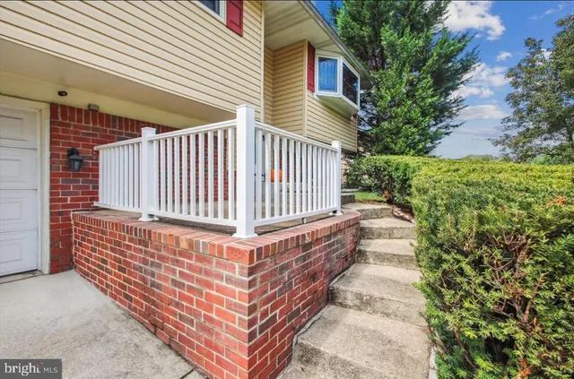 a view of a backyard with pathway