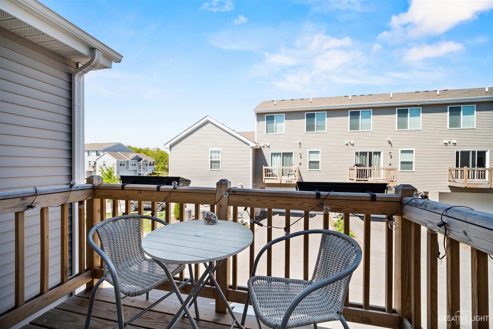 2342 Upland Road Pingree Grove, IL 60140 - Photo 21 of 22 a view of a balcony with two chairs and a table