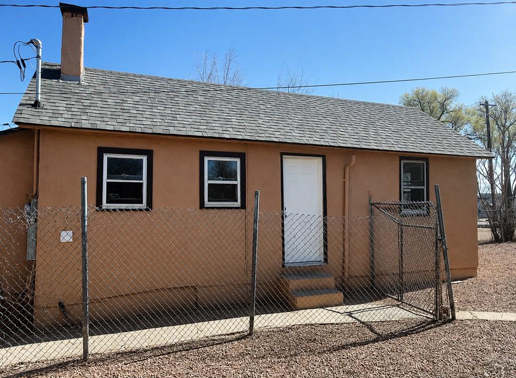 207 Spring Street Pueblo, CO 81003 - Photo 8 of 11 a front view of a house