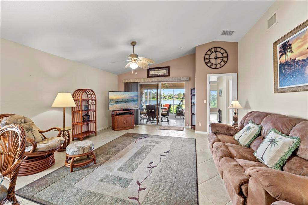 19647 Villa Rosa Loop Estero, FL 33967 - Photo 11 of 48 a living room with furniture and a flat screen tv