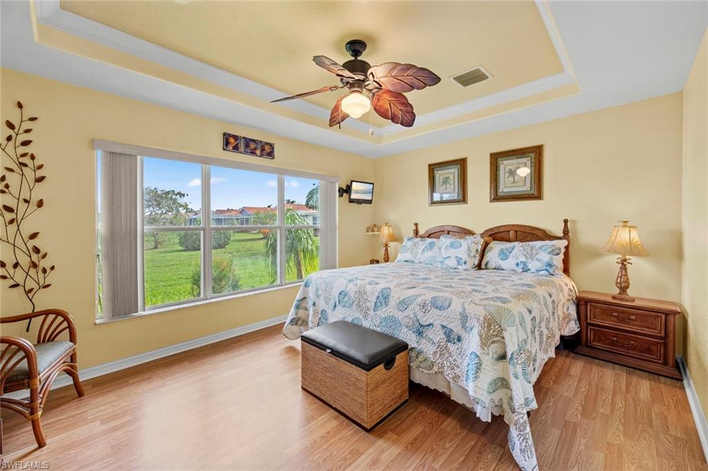 19647 Villa Rosa Loop Estero, FL 33967 - Photo 22 of 48 a bedroom with a bed and a large window