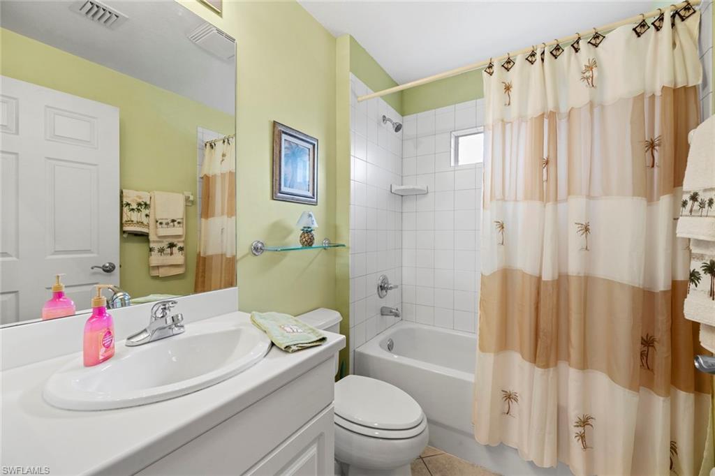 19647 Villa Rosa Loop Estero, FL 33967 - Photo 26 of 48 a bathroom with a sink toilet and shower