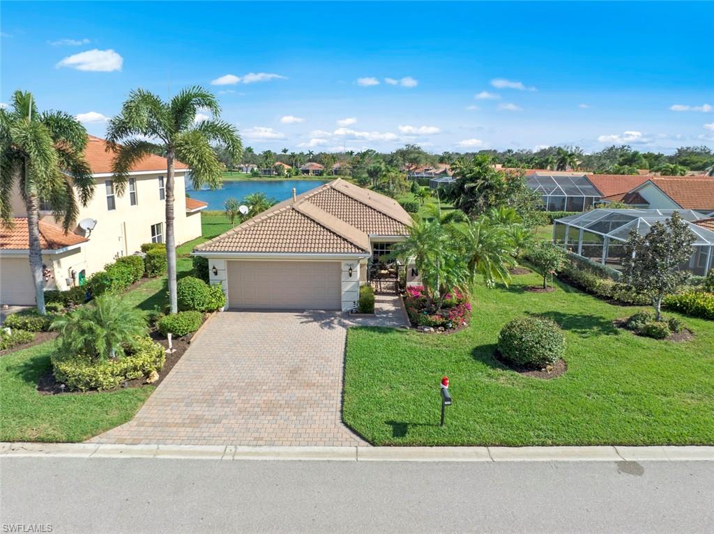 19647 Villa Rosa Loop Estero, FL 33967 - Photo 3 of 48 a view of a garden with potted plants