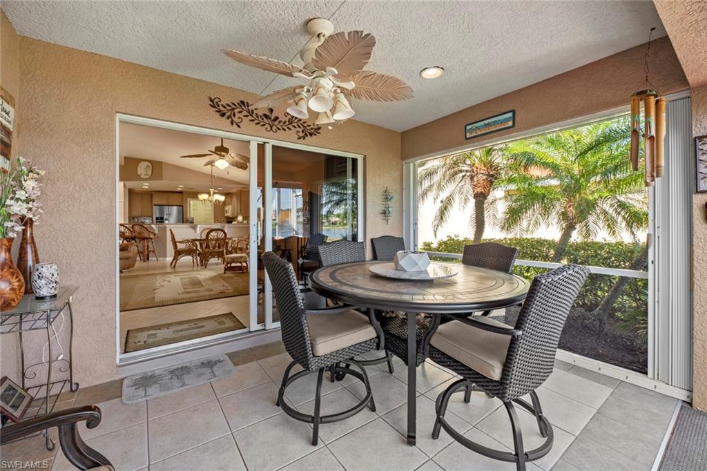 19647 Villa Rosa Loop Estero, FL 33967 - Photo 33 of 48 a view of a dining room with furniture window and outside view