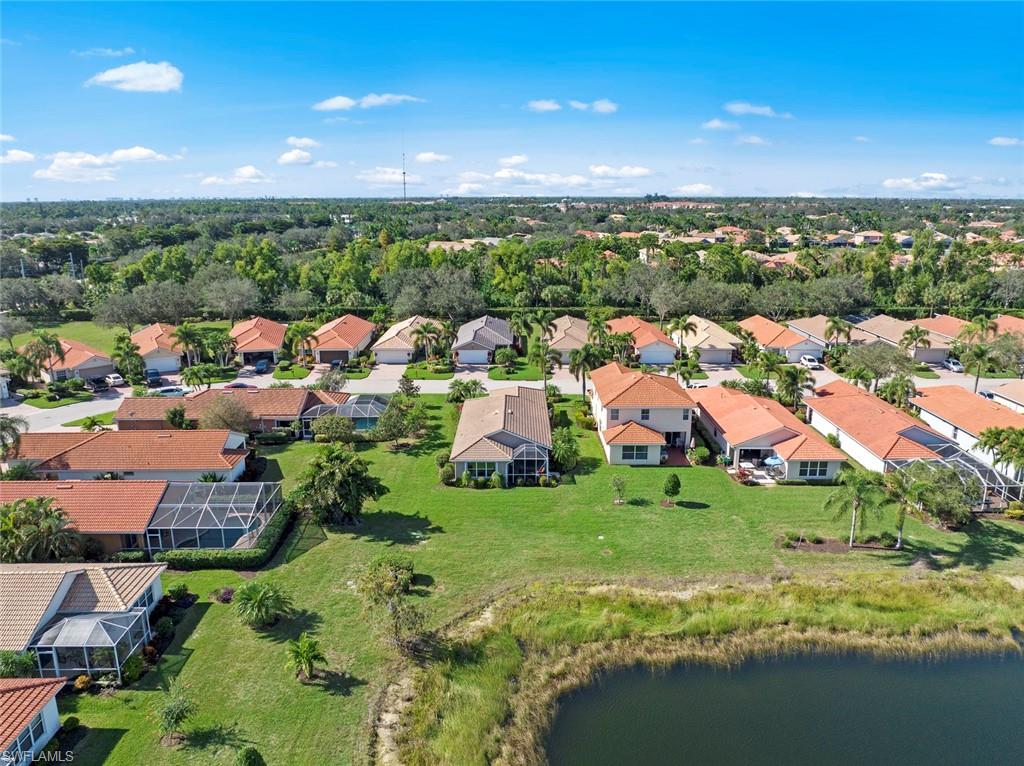 19647 Villa Rosa Loop Estero, FL 33967 - Photo 38 of 48 an aerial view of residential houses with outdoor space and trees