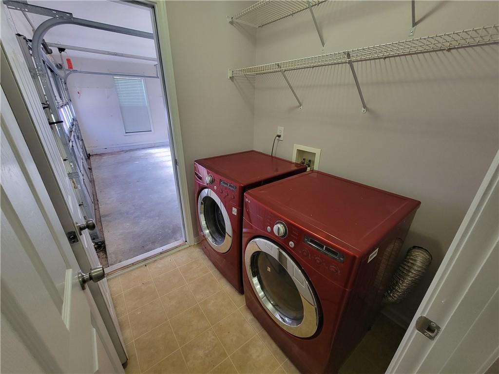 2213 Carlton Chase Road Dacula, GA 30019 - Photo 23 of 30 a utility room with dryer and washer