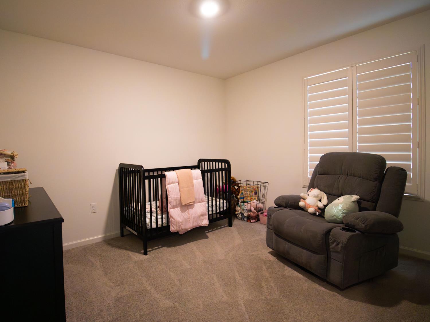 1451 Ryan Avenue Fowler, CA 93625 - Photo 17 of 23 a living room with furniture and a window