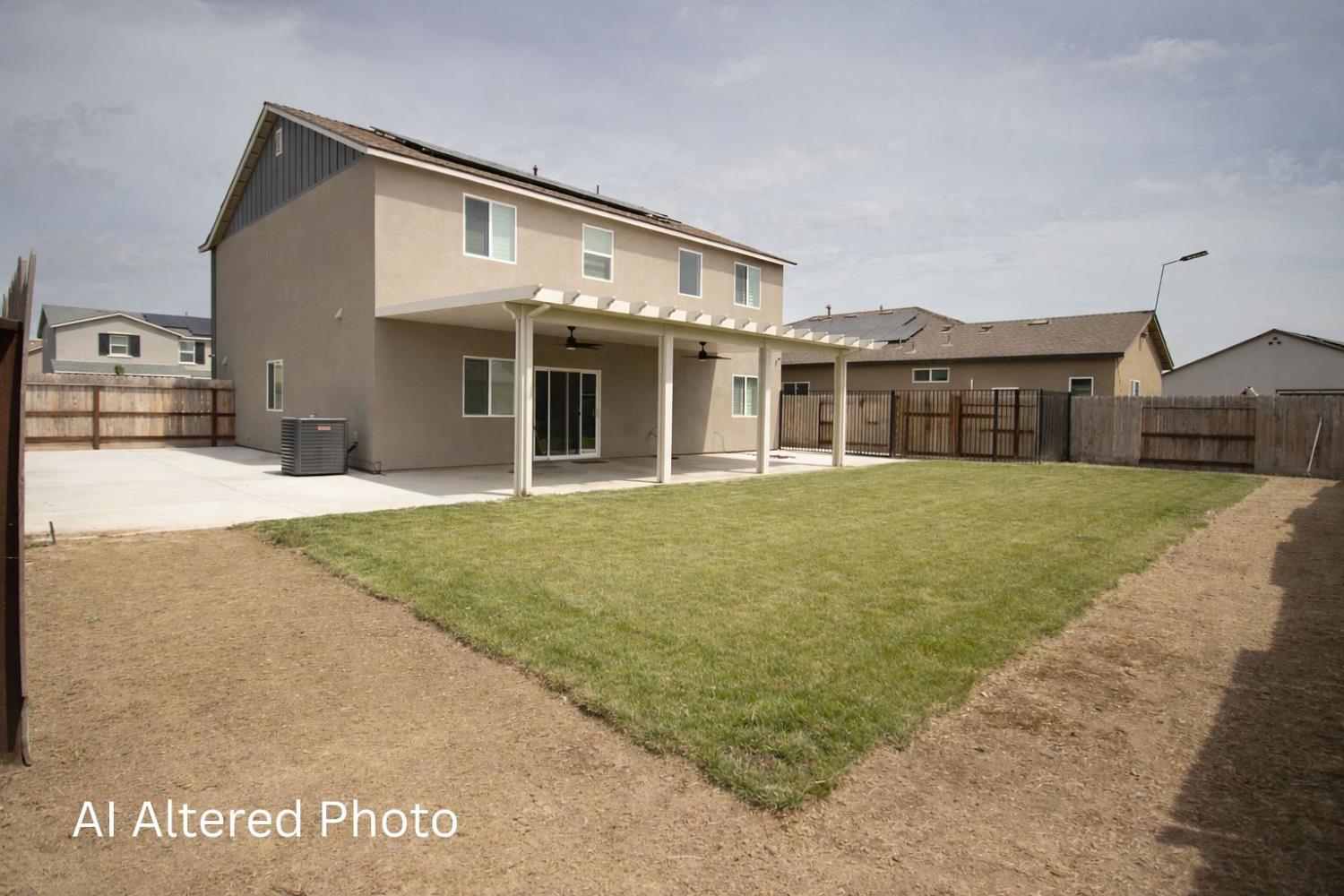 1451 Ryan Avenue Fowler, CA 93625 - Photo 21 of 23 a front view of house with yard
