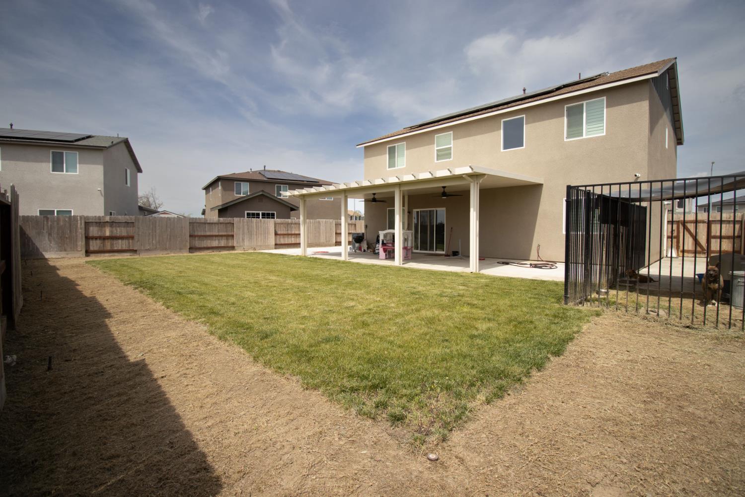 1451 Ryan Avenue Fowler, CA 93625 - Photo 22 of 23 a front view of a house with a yard