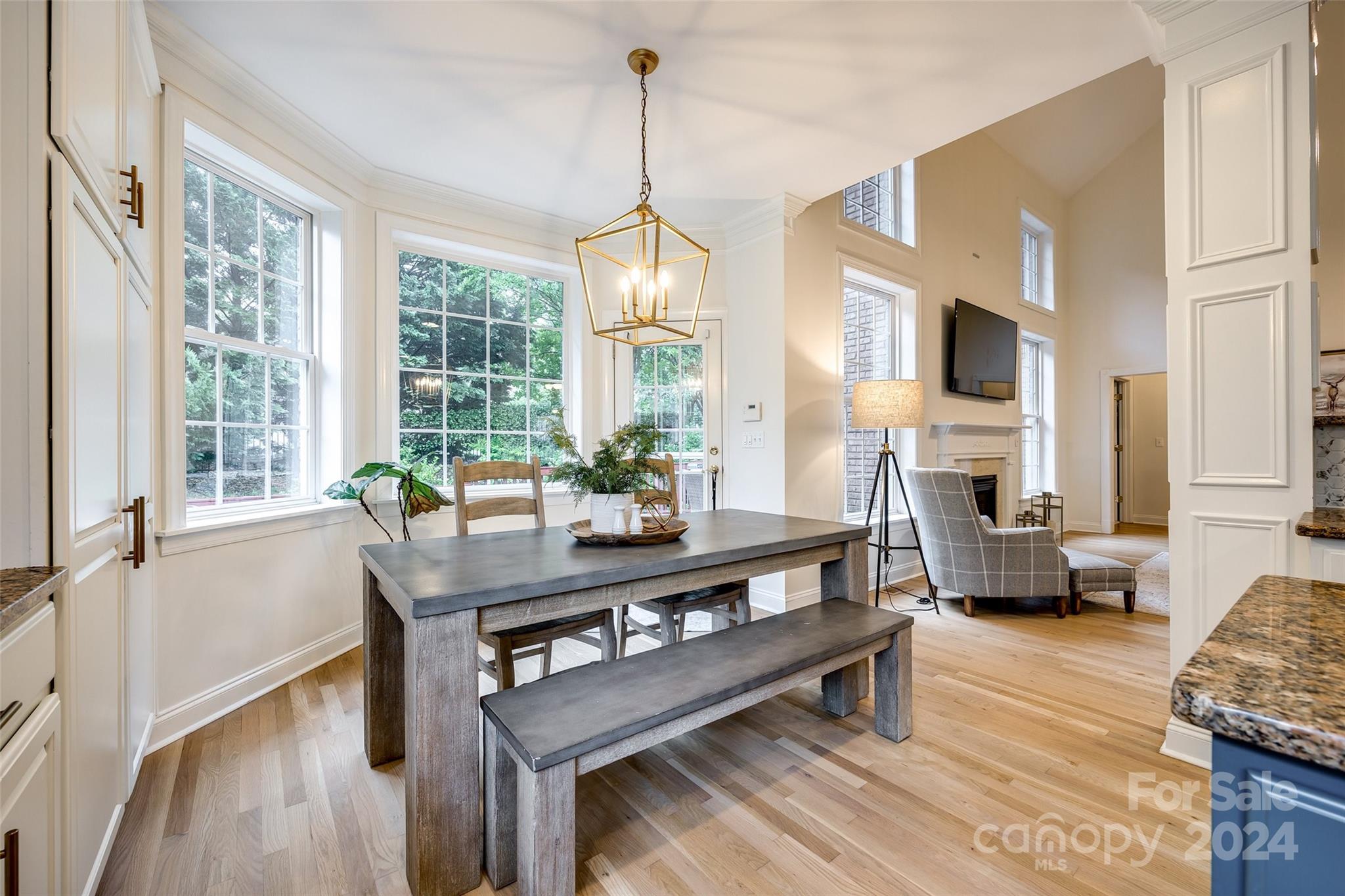 2004 Emerald Pines Drive Tega Cay, SC 29708 - Photo 11 of 30 a view of a dining room with furniture window and wooden floor