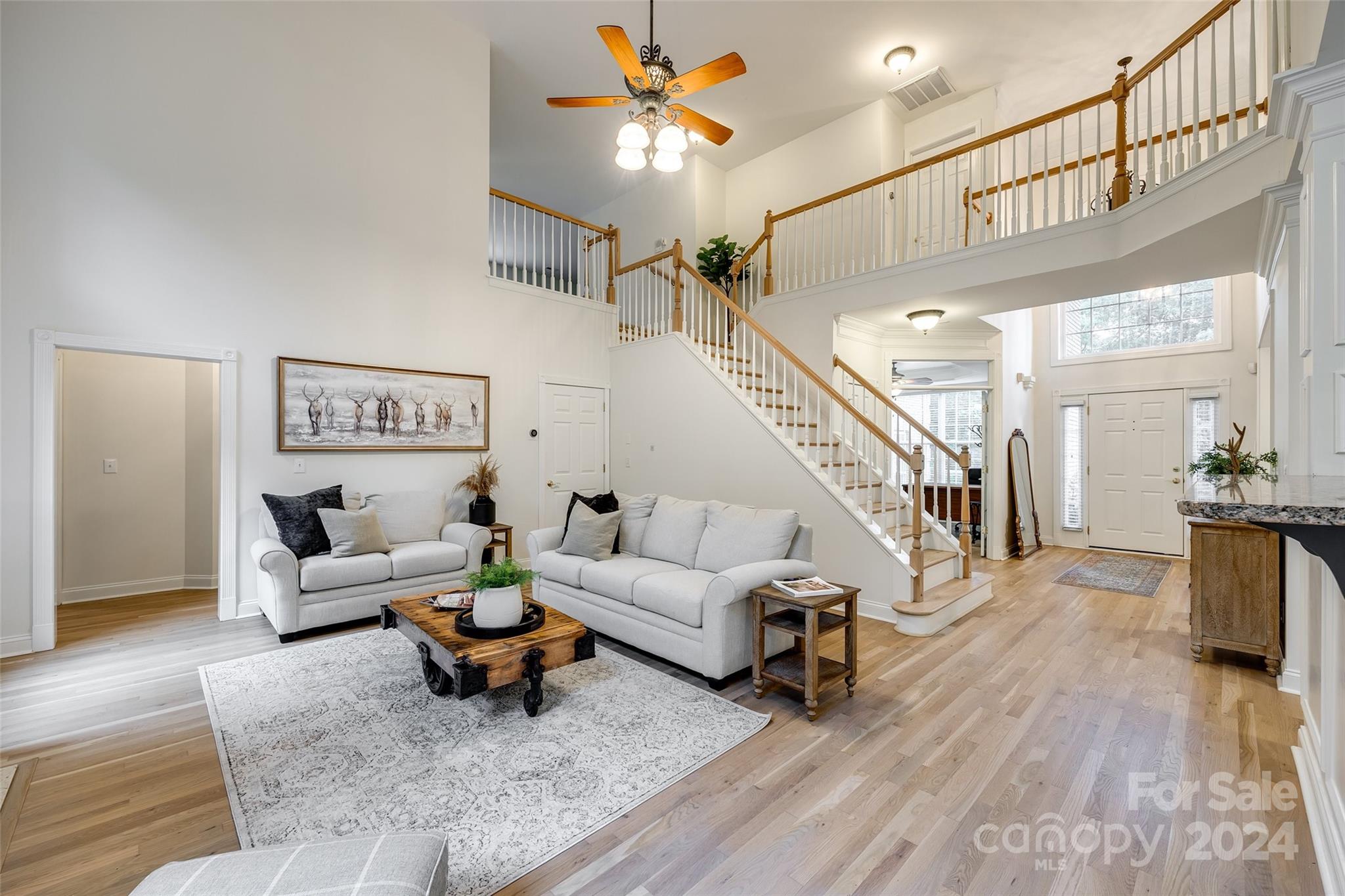 2004 Emerald Pines Drive Tega Cay, SC 29708 - Photo 13 of 30 a living room with furniture and wooden floor