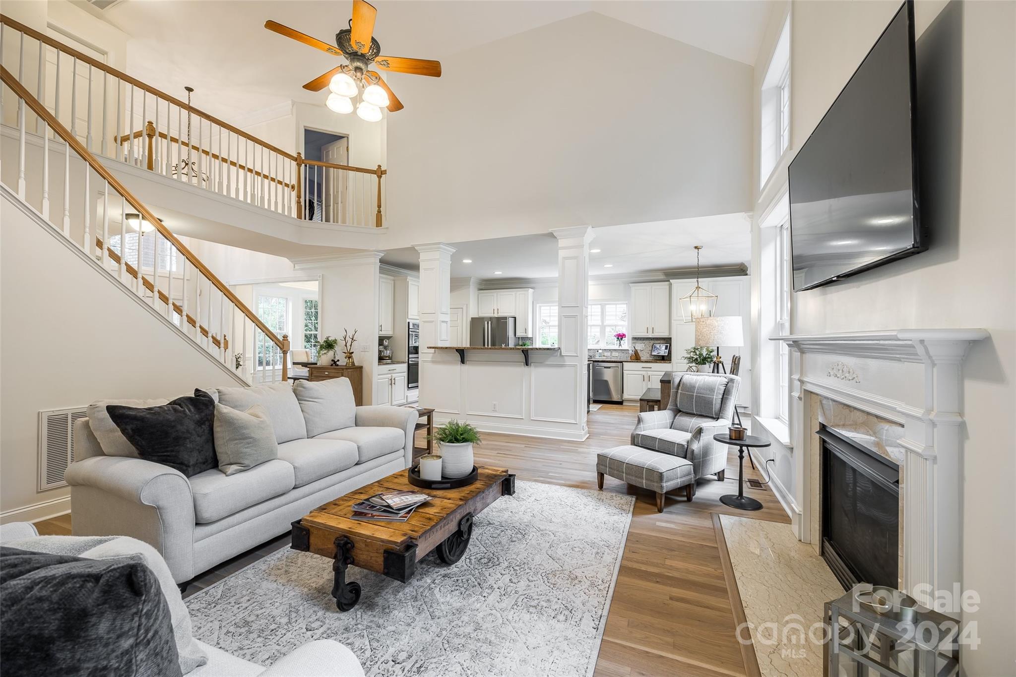 2004 Emerald Pines Drive Tega Cay, SC 29708 - Photo 14 of 30 a living room with furniture fireplace and a flat screen tv