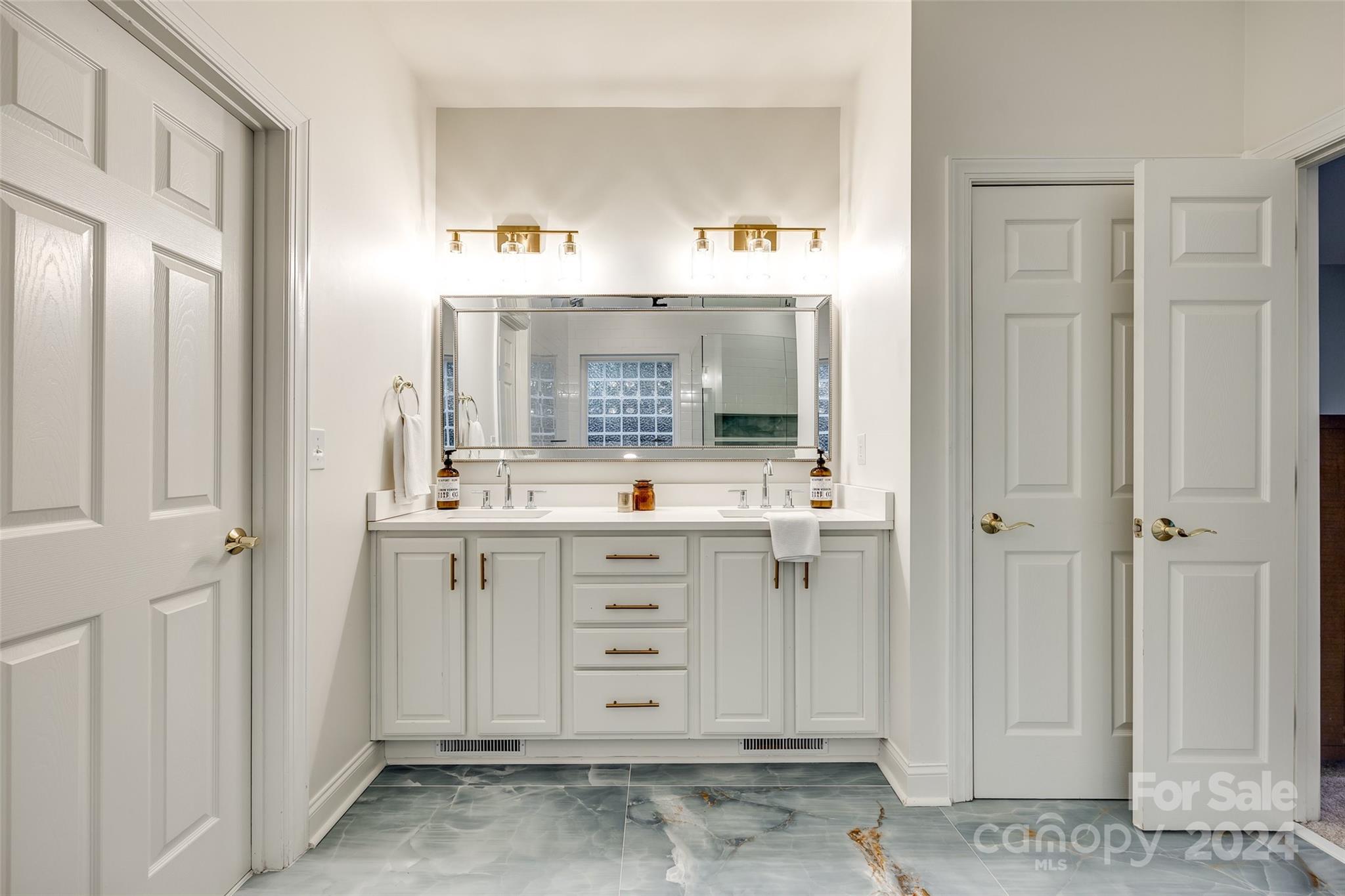 2004 Emerald Pines Drive Tega Cay, SC 29708 - Photo 20 of 30 a bathroom with a sink vanity and mirror