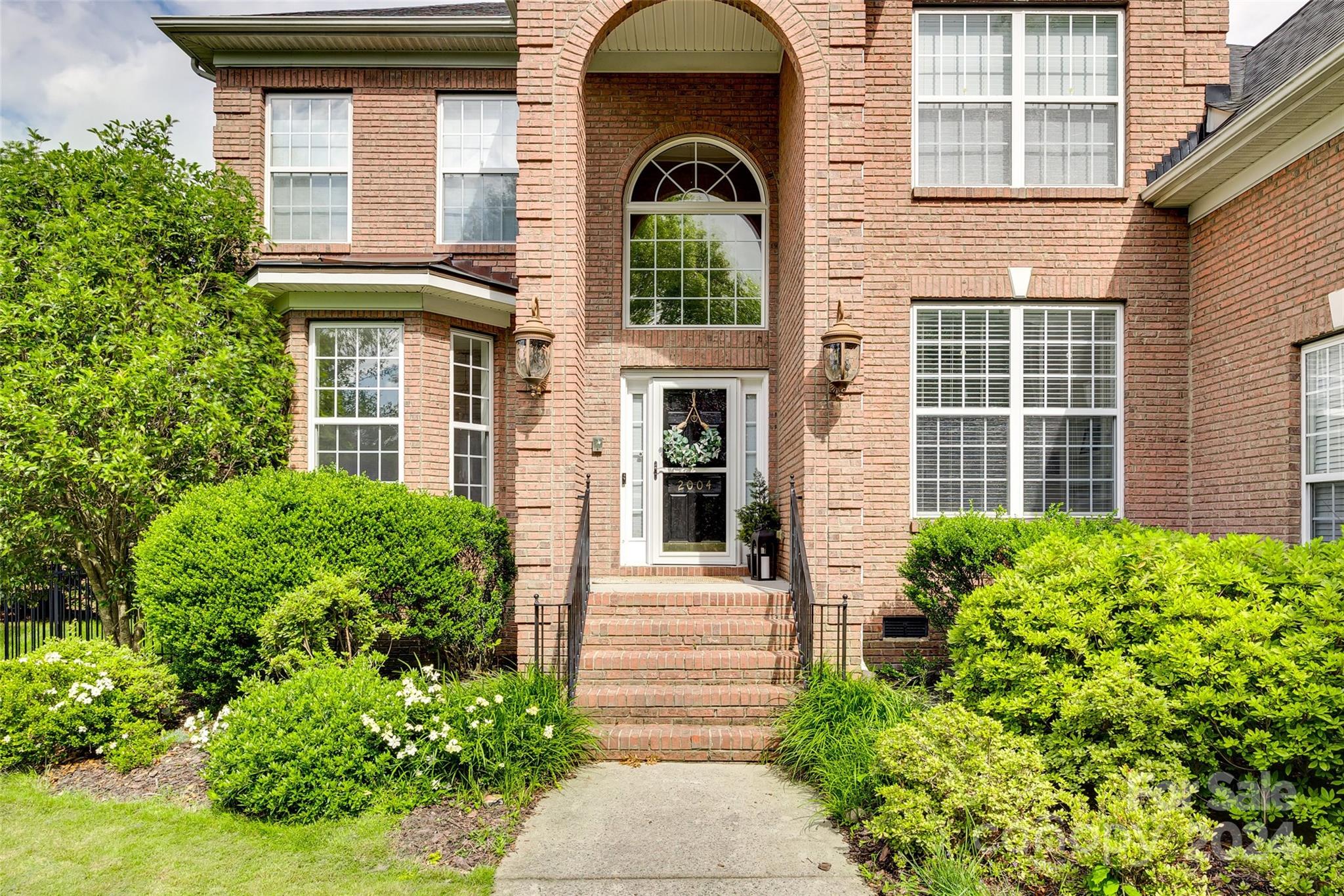 2004 Emerald Pines Drive Tega Cay, SC 29708 - Photo 2 of 30 a house view with a outdoor space