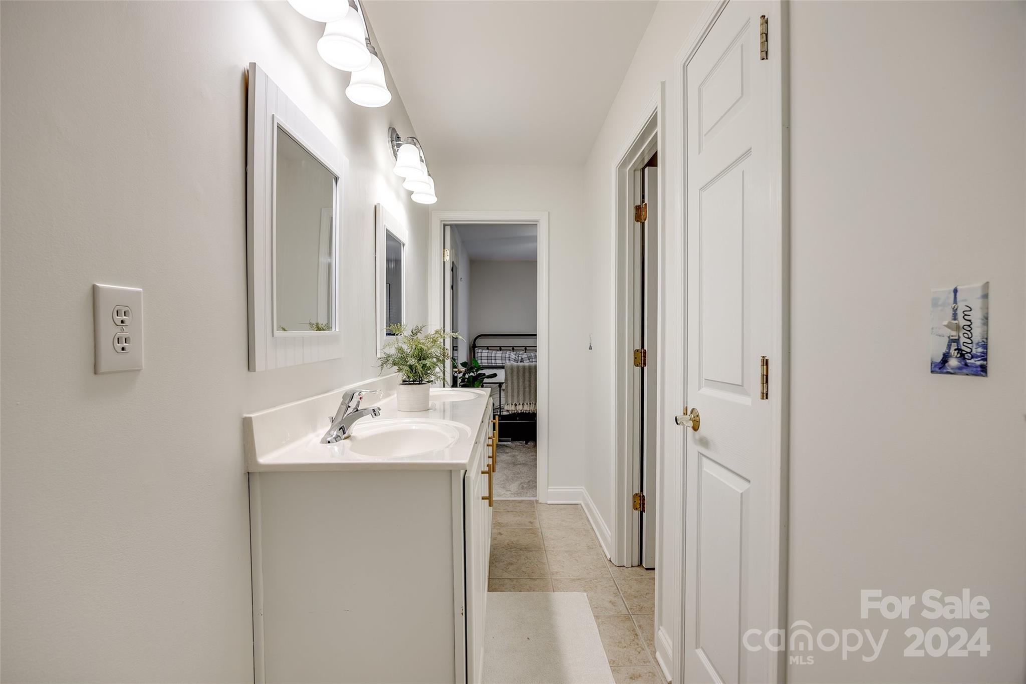 2004 Emerald Pines Drive Tega Cay, SC 29708 - Photo 26 of 30 a en suite bathroom with a sink vanity and mirror