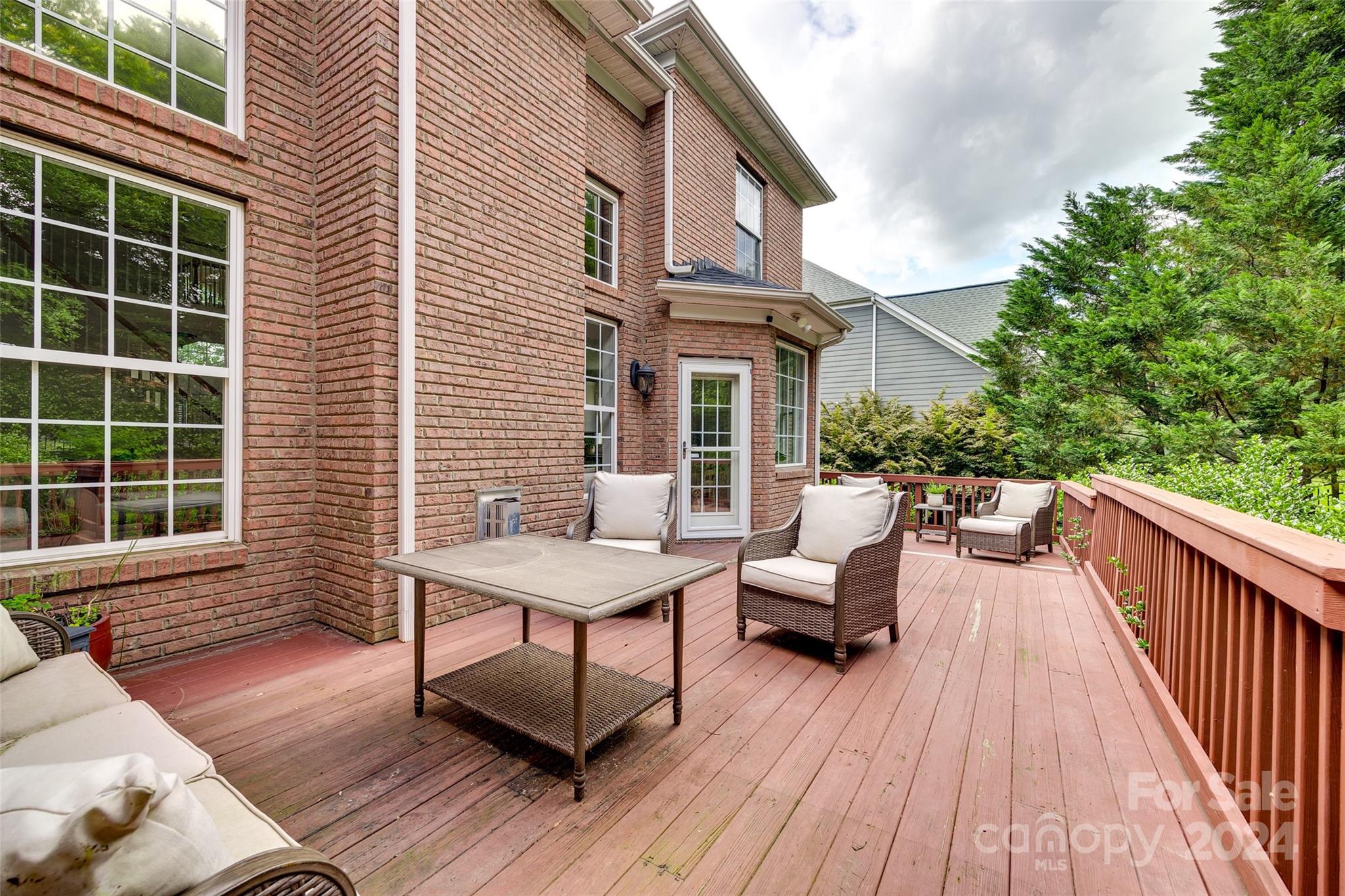 2004 Emerald Pines Drive Tega Cay, SC 29708 - Photo 28 of 30 a balcony with wooden floor and furniture