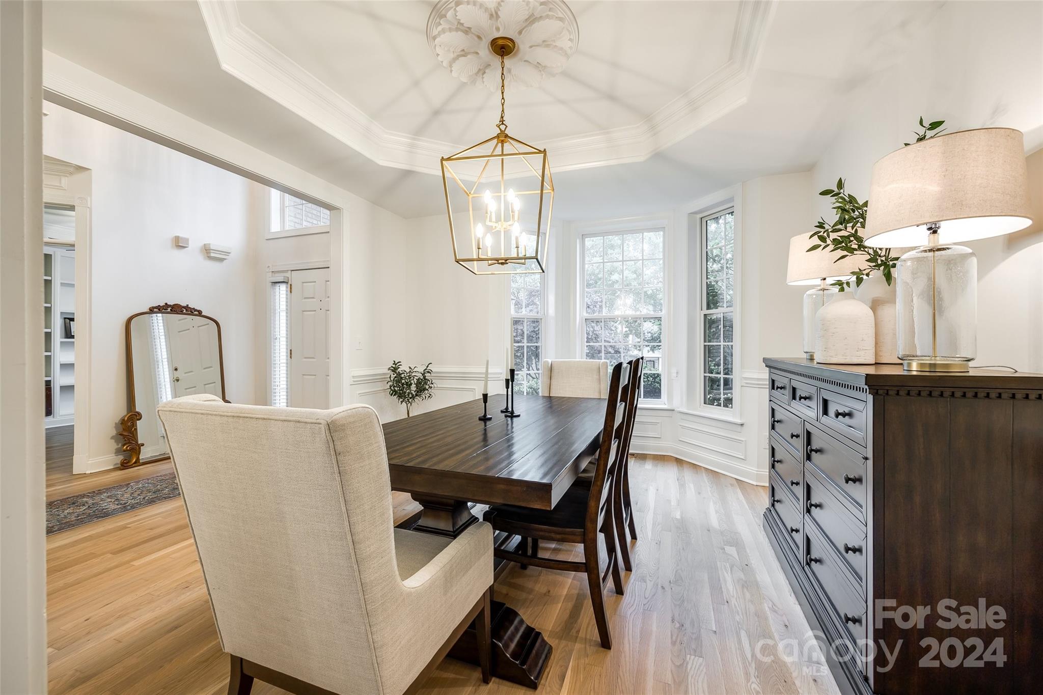 2004 Emerald Pines Drive Tega Cay, SC 29708 - Photo 5 of 30 a view of a dining room with furniture window and wooden floor