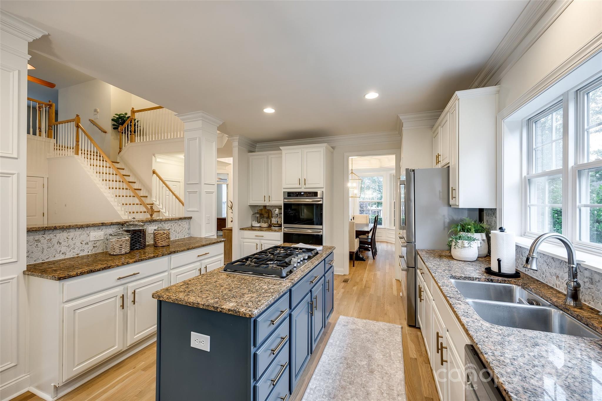 2004 Emerald Pines Drive Tega Cay, SC 29708 - Photo 10 of 30 a kitchen with stainless steel appliances granite countertop a sink stove and refrigerator