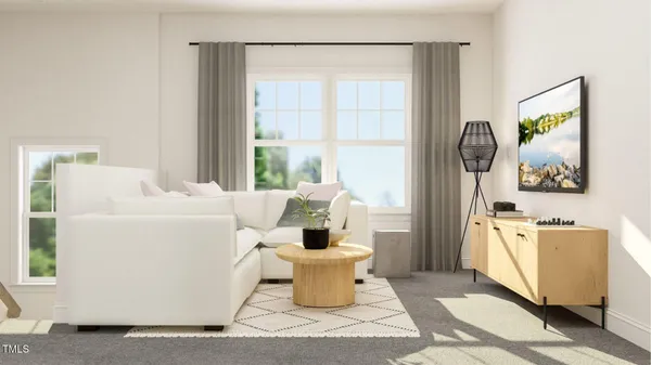 a living room with furniture a sink and a window